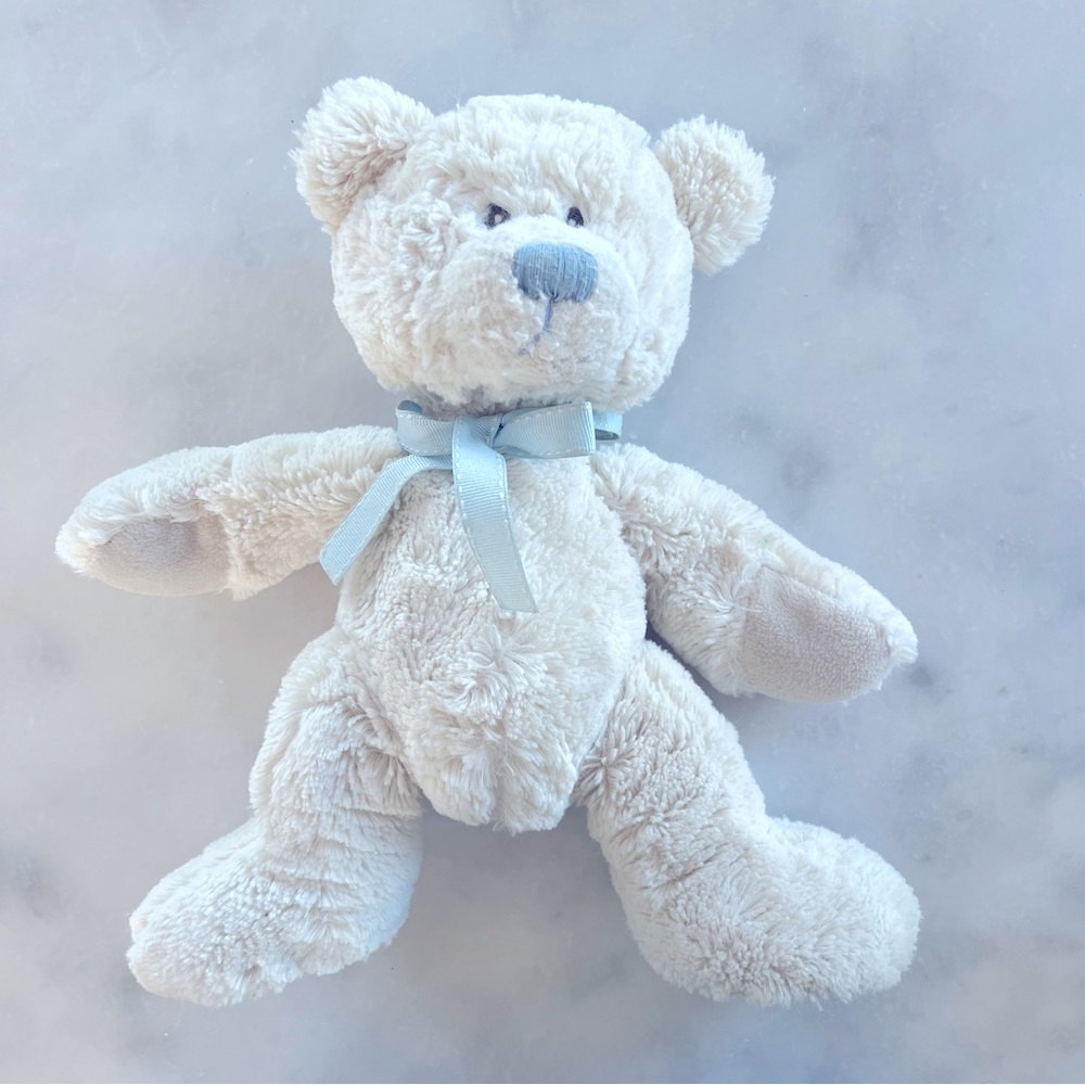 White teddy bear with blue ribbon. 11”